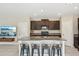 Kitchen with a large island, granite countertops, and stainless steel appliances at 11944 Miracle Mile Dr, Riverview, FL 33578