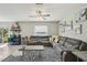Comfortable living room featuring a gray sectional sofa and a contemporary zebra-print rug at 11944 Miracle Mile Dr, Riverview, FL 33578