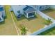 Aerial view of a fenced backyard with an outdoor seating area and well-manicured lawn at 12294 Cypress Branch St, Riverview, FL 33579