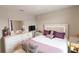 Bright bedroom featuring a comfortable queen bed with a modern white headboard and a dresser at 12294 Cypress Branch St, Riverview, FL 33579