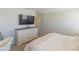 Serene bedroom featuring a TV on the wall, a dresser, and a comfortable bed at 12294 Cypress Branch St, Riverview, FL 33579