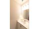 Clean powder room featuring a modern vanity, contemporary lighting, and neutral decor at 12294 Cypress Branch St, Riverview, FL 33579