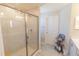 Shower with seamless glass, rain shower head and a built-in bench at 12294 Cypress Branch St, Riverview, FL 33579