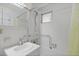 Bathroom boasts bright vanity, grab bar, shower head, and tiled walls at 130 4Th N Ave # 315, St Petersburg, FL 33701