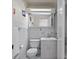 Clean white bathroom features a toilet, sink with cabinet, and mirrored medicine cabinet at 130 4Th N Ave # 315, St Petersburg, FL 33701