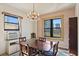 Bright dining room featuring a chandelier and a window with urban views at 130 4Th N Ave # 315, St Petersburg, FL 33701
