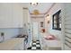 Retro kitchen featuring a pink sink, black and white floors, and vintage appliances at 130 4Th N Ave # 315, St Petersburg, FL 33701