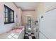 Classic kitchen with pink accents and a black and white checkered floor at 130 4Th N Ave # 315, St Petersburg, FL 33701