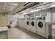 Well-lit community laundry room with multiple washing machines, providing convenience for residents at 130 4Th N Ave # 315, St Petersburg, FL 33701