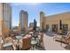 Expansive rooftop terrace with seating, umbrellas, and views of the city skyline at 130 4Th N Ave # 315, St Petersburg, FL 33701