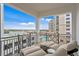 Relaxing balcony with lounge seating, a view of the pool, and the city skyline in the distance at 146 4Th Ne Ave # 600, St Petersburg, FL 33701