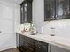 Modern bar area with dark wood cabinetry, white subway tile backsplash, and wine storage at 146 4Th Ne Ave # 600, St Petersburg, FL 33701