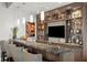 Stylish bar area with granite countertops, custom cabinetry, and a mounted television at 146 4Th Ne Ave # 600, St Petersburg, FL 33701