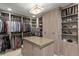 A well-organized walk-in closet with shelving, hanging rods, and center island at 146 4Th Ne Ave # 600, St Petersburg, FL 33701