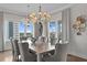 Open dining area features modern chandelier, large windows, and stylish decor at 146 4Th Ne Ave # 600, St Petersburg, FL 33701