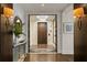 Hallway leading to elevator features unique lighting fixture, rug, and decorative plants at 146 4Th Ne Ave # 600, St Petersburg, FL 33701