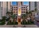 Stunning building exterior with palm trees and manicured landscaping in a vibrant urban setting at twilight at 146 4Th Ne Ave # 600, St Petersburg, FL 33701