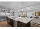 Open kitchen with stainless steel appliances, stone countertops, and seamless flow to the living spaces at 146 4Th Ne Ave # 600, St Petersburg, FL 33701