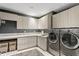 Well-organized laundry room with modern washer/dryer, ample counter space, and lots of cabinet storage at 146 4Th Ne Ave # 600, St Petersburg, FL 33701