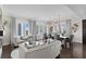 Open-concept living area showcasing hardwood floors, a spacious seating arrangement, a formal dining area and cityscape views at 146 4Th Ne Ave # 600, St Petersburg, FL 33701