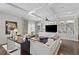 Bright and airy living room with hardwood floors, coffered ceilings, custom shelving, and plush furnishings at 146 4Th Ne Ave # 600, St Petersburg, FL 33701