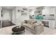 Bright living room featuring a cozy couch, built-in shelving and cabinets with a round coffee table at 146 4Th Ne Ave # 600, St Petersburg, FL 33701