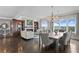 Elegant living room featuring hardwood floors, a fireplace, custom built-ins, and a formal dining area with stylish lighting at 146 4Th Ne Ave # 600, St Petersburg, FL 33701