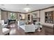 Open living room featuring hardwood floors, fireplace, comfortable seating, and piano at 146 4Th Ne Ave # 600, St Petersburg, FL 33701