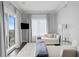 Light-filled sitting room with balcony access, plush seating, and sophisticated decor at 146 4Th Ne Ave # 600, St Petersburg, FL 33701