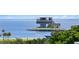 A modern waterfront building with a scenic view of the bay, palm trees, and clear blue waters at 146 4Th Ne Ave # 600, St Petersburg, FL 33701