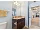 Bathroom features a vanity with a granite countertop and a decorative mirror at 19432 Whispering Brook Dr, Tampa, FL 33647