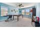 Bedroom with a large table, art supplies, and plenty of natural light from the multiple windows at 19432 Whispering Brook Dr, Tampa, FL 33647