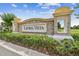 Stone entrance sign for the Laurel Vista community, surrounded by lush landscaping at 19432 Whispering Brook Dr, Tampa, FL 33647