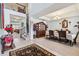 Elegant dining area featuring a chandelier, staircase, and a stylish rug at 19432 Whispering Brook Dr, Tampa, FL 33647