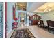 Inviting foyer with a chandelier, staircase, and dining area, creating a grand entrance at 19432 Whispering Brook Dr, Tampa, FL 33647