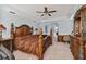 Spacious main bedroom showcasing a tray ceiling, ceiling fan, and elegant furnishings at 19432 Whispering Brook Dr, Tampa, FL 33647