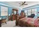 Bright main bedroom features ornate wooden furniture, including a bed and a dresser at 19432 Whispering Brook Dr, Tampa, FL 33647