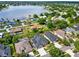 The neighborhood features a lake, mature trees, and well-maintained lawns at 22647 Eagles Watch Dr, Land O Lakes, FL 34639