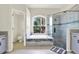 A modern bathroom features a soaking tub and walk-in shower with elegant tile work and contemporary fixtures at 22647 Eagles Watch Dr, Land O Lakes, FL 34639