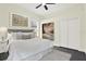 Bedroom featuring hardwood floor, ceiling fan, and neutral walls, creating a serene atmosphere at 22647 Eagles Watch Dr, Land O Lakes, FL 34639
