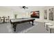 Entertaining is easy in this bonus room that includes a billiards table and large TV at 22647 Eagles Watch Dr, Land O Lakes, FL 34639