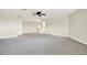 Upstairs bonus room with neutral paint and carpet offers versatile living and entertainment options at 22647 Eagles Watch Dr, Land O Lakes, FL 34639