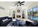 Bright living room featuring a fireplace with view of exterior at 22647 Eagles Watch Dr, Land O Lakes, FL 34639