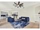 Comfortable living room featuring a fireplace, and an adjacent bar and island at 22647 Eagles Watch Dr, Land O Lakes, FL 34639