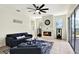 Open-concept living area featuring a fireplace with view of exterior at 22647 Eagles Watch Dr, Land O Lakes, FL 34639