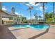 Inviting screened-in pool and spa area surrounded by a spacious patio and lush greenery at 22647 Eagles Watch Dr, Land O Lakes, FL 34639