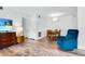 Cozy dining area shows a wood table with chairs and a blue reclining chair at 2348 Shelley St # 8, Clearwater, FL 33765