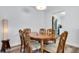 Dining area features a wooden table with ornate chairs and bright overhead lighting at 2348 Shelley St # 8, Clearwater, FL 33765
