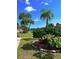 Landscaped corner of a building with flowers and trees at 2348 Shelley St # 8, Clearwater, FL 33765