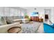Bright living room featuring a sectional sofa, a fluffy rug, and wood-look floors at 2348 Shelley St # 8, Clearwater, FL 33765